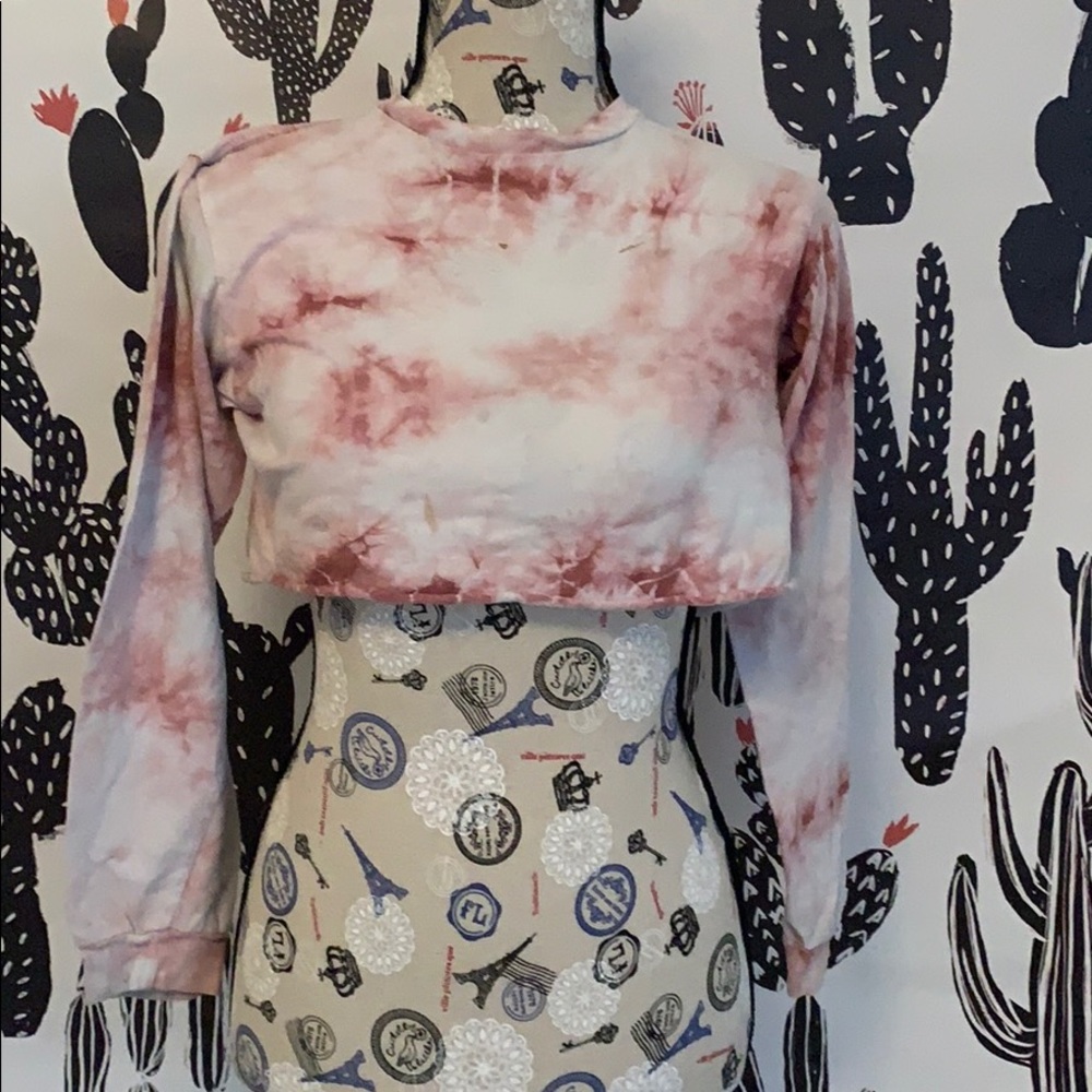 A tie-dyed crop top long sleeved